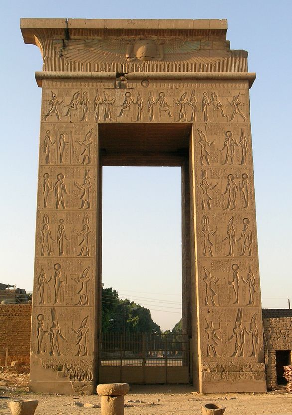 the entrance to an ancient egyptian temple with carvings on it's walls and pillars