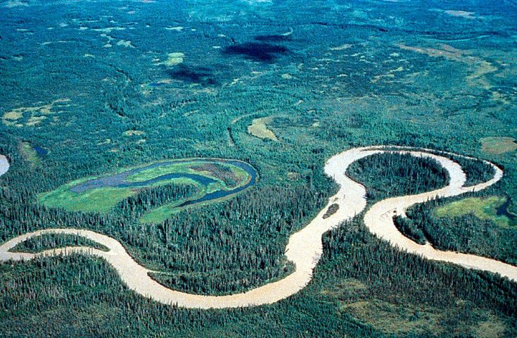 an aerial view of a river running through the middle of some land in the ocean