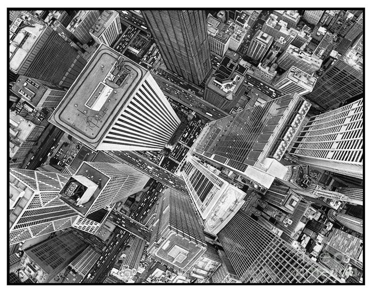 black and white photograph of city buildings from above