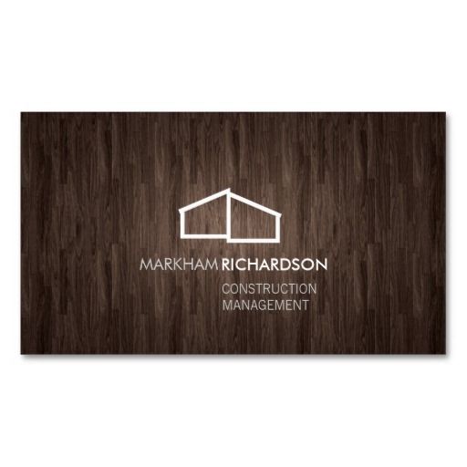 a wooden business card with the words,'construction management'in white on it