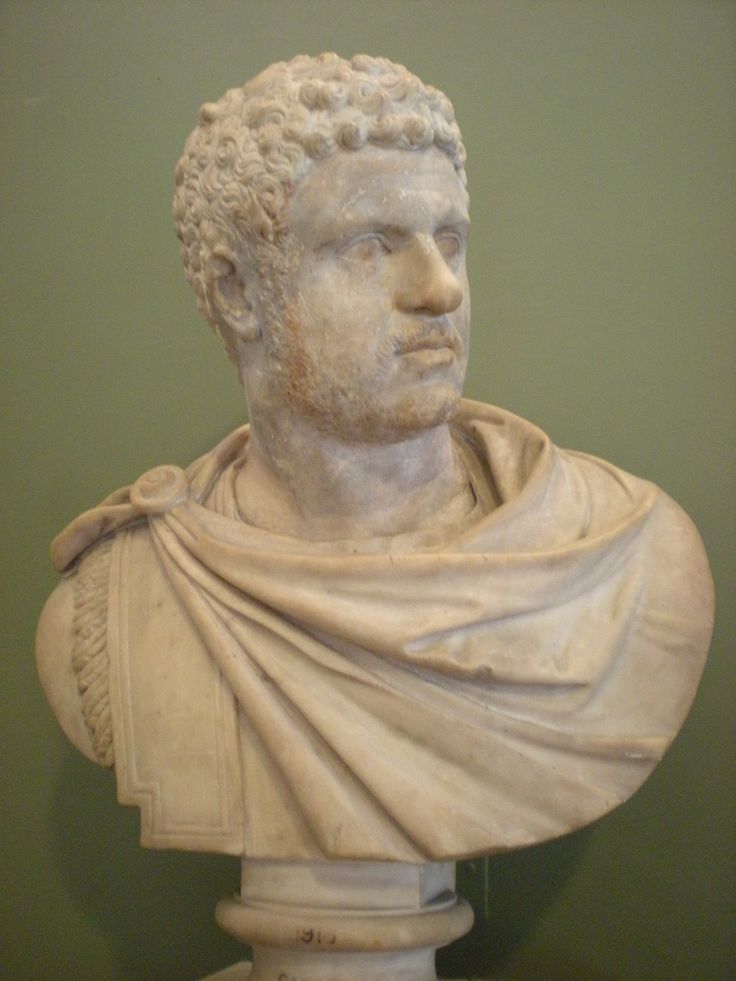 a bust of a man wearing a cape