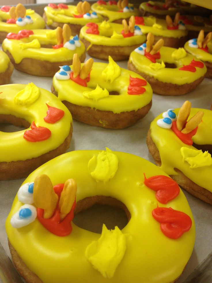 yellow frosted donuts with red, white and blue decorations