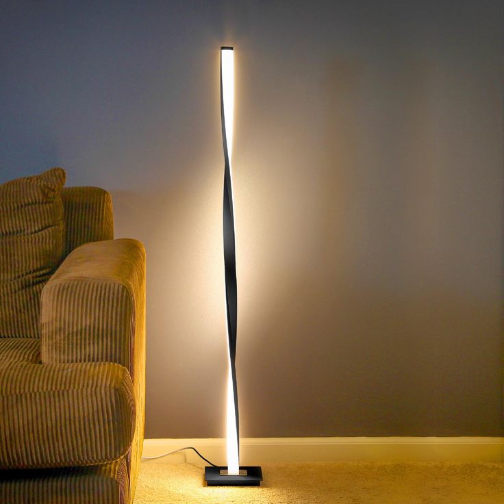 The elegant and unique style of the modern Helix LED Floor Lamp is sure to impress any that beholds its beauty. The gently twisting fixture stays true to that modern elegance, making it a beautiful addition to your bedroom, office, or study! Brightech 48-in Classic Black Stick Floor Lamp | HLX-BLCK Black Lamps Living Room, Cool Office Design, Pole Lamp, Pole Lamps, Stylish Floor Lamp, Wellness Massage, Industrial Floor Lamps, Tall Lamps, Minimalist Vintage