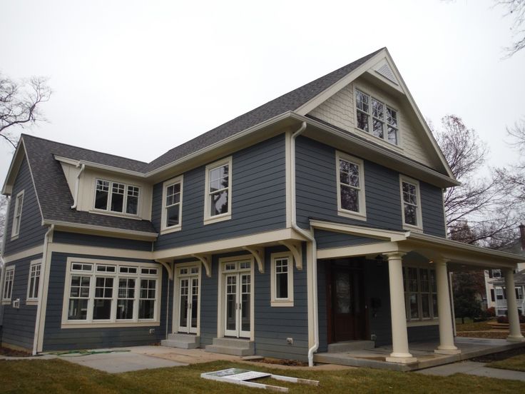 a blue house with white trim and windows