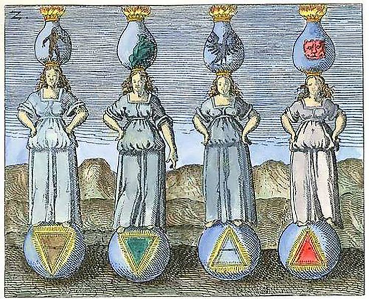 four women standing on top of balls with their heads in the shape of pyramids