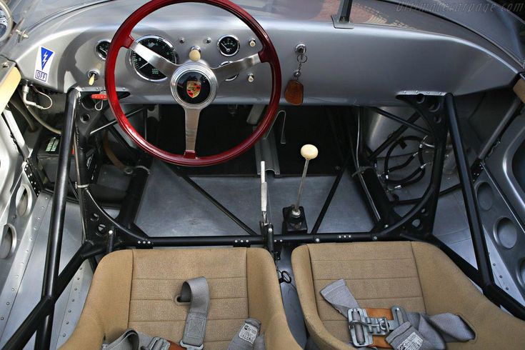 the inside of a car with steering wheel and dashboard