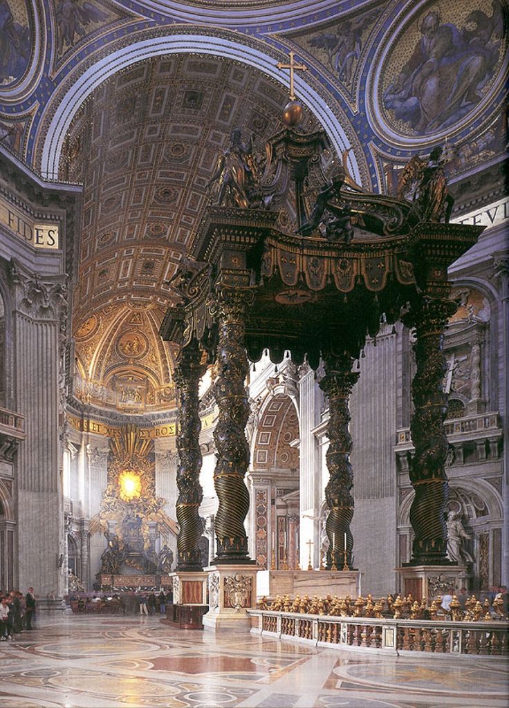 the interior of an ornate building with columns and paintings on the walls, along with marble flooring