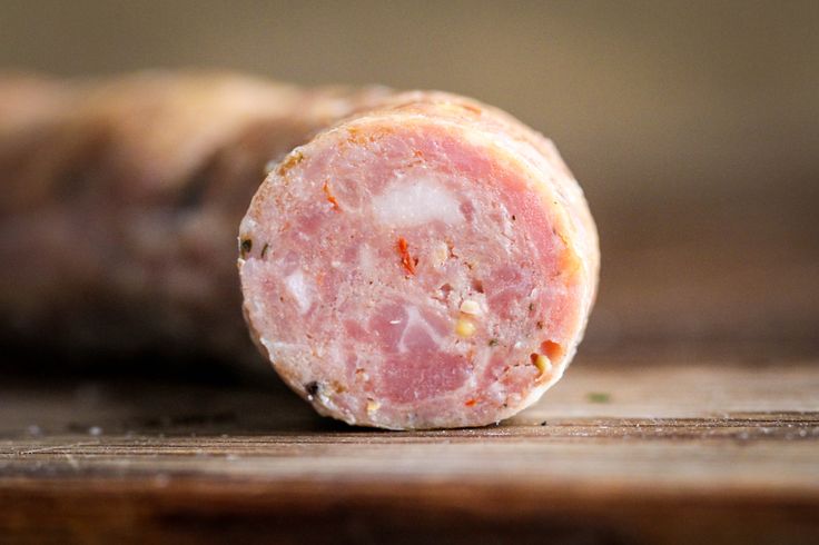 a piece of meat sitting on top of a wooden table