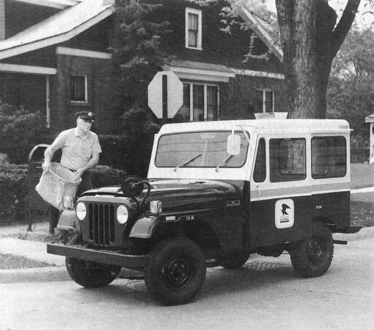 an old black and white photo of a man standing next to a jeep with the number 1 on it