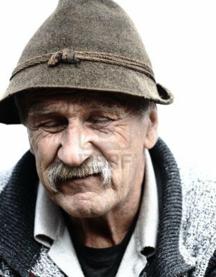 an old man with a mustache wearing a hat