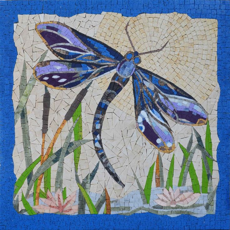 a blue dragonfly sitting on top of a mosaic tile wall next to water lilies