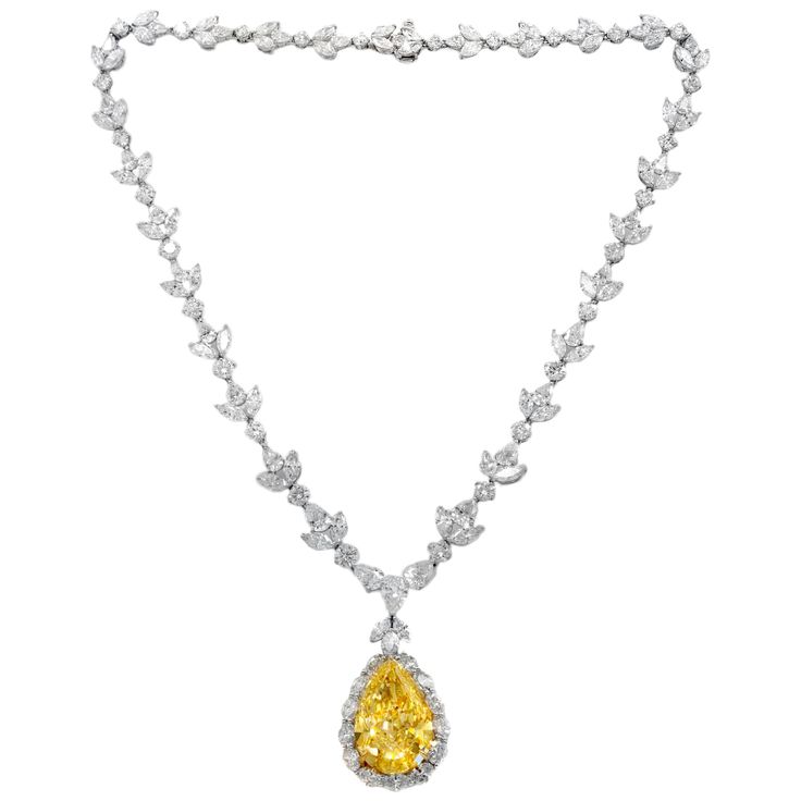 Platinum diamond necklace with GIA certified center 35.31 fancy intense vivd yellow vs2 pear shape, GIA#2145952743 set in platinum handmade necklace, features 47.00ct of outside diamonds D/E/F VVS-VS quality. Plus center 1.50ct pear e vs1 GIA#24155411814 Yellow Diamond Jewelry, Most Expensive Jewelry, Expensive Necklaces, Yellow Diamond Necklace, Drop Necklaces, Diamond Tattoos, Diamond Mangalsutra, Diamond Pendant Sets, Yellow Diamonds