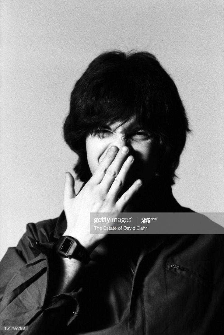 a man covering his face with his hands, black and white photo stock - fotor