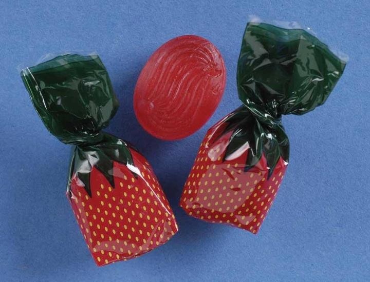 three wrapped strawberries sitting next to each other