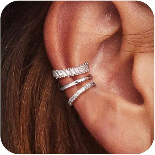 a woman's ear with two silver rings on it