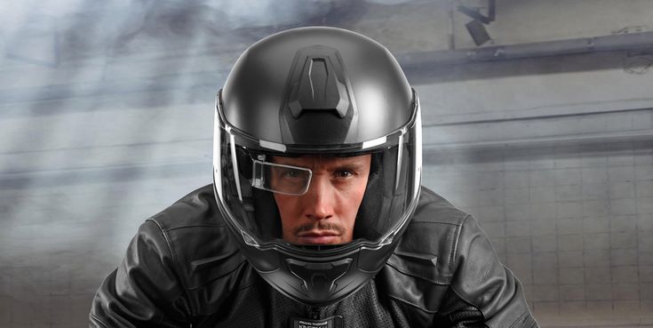 a man wearing a motorcycle helmet and goggles