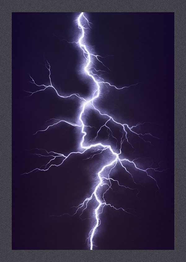 lightning strikes across the night sky in front of black background with white border and gray edges