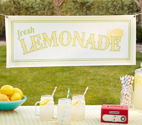 a lemonade bar set up on a table outside