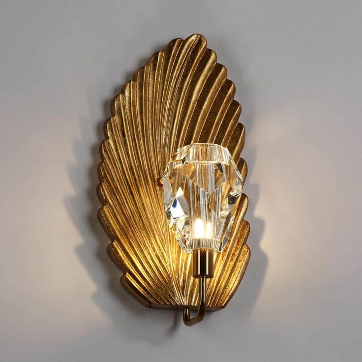 Introducing the exquisite 16 in. H 1-Light Modern Gold Foil Wall Sconce with Crystal Shade! Elevate your space with this captivating lighting fixture that combines elegance and sophistication. Ideal for enhancing hallways, bedrooms, or living areas, this wall sconce becomes a statement piece that adds a touch of glamour to any room. The antique gold foil finish exudes a timeless charm, while the intricate golden leaf element enhances its luxurious appeal. The crystal shade diffuses light beautif Metal Bathroom Vanity, Powder Room Lighting, Bathroom Wall Lighting, Vintage Farmhouse Style, Crystal Wall Sconces, Vintage Wall Lights, Stair Lighting, Gold Glam, Modern Wall Sconces