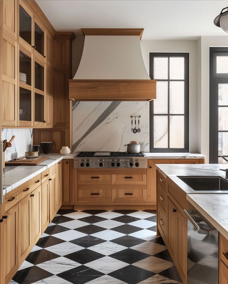 a kitchen with black and white checkered flooring, wooden cabinets and an oven