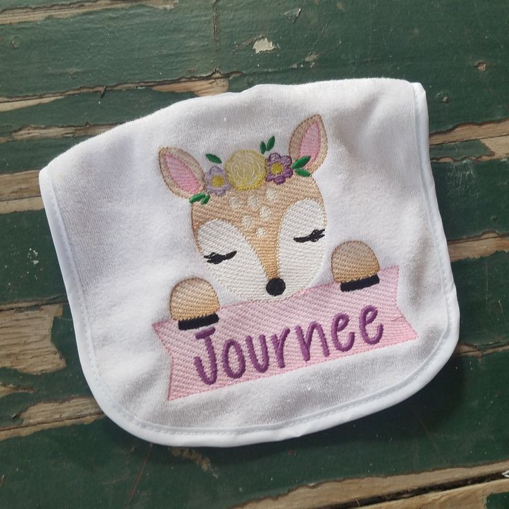 "This bib comes embroidered on the baby bib color of your choice. Your baby's name is personalized across the banner beneath this adorable fawn. Perfect for baby shower gifts, birthdays, and any time of year! Please select the following options: premade or handmade: A premade bib means I purchased a terrycloth bib and embroidered it in my studio. The bib part measures 8 1/2 by 7 inches and it's 12 inches from the top of the bib to the bottom including the straps with the Velcro fastened. Why are Handmade Bib, Tooth Pillow, Personalized Baby Bibs, Pocket Pillow, Personalized Banners, Tooth Fairy Pillow, Dress Up Dolls, Applique Fabric, Red Riding Hood