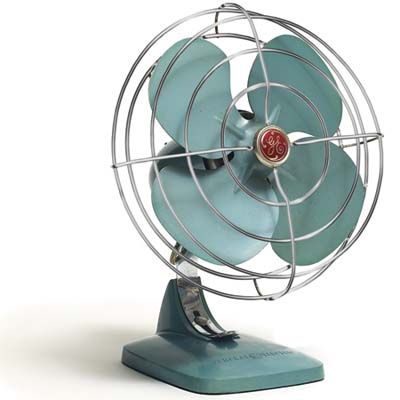 a small blue fan sitting on top of a metal stand in front of a white background