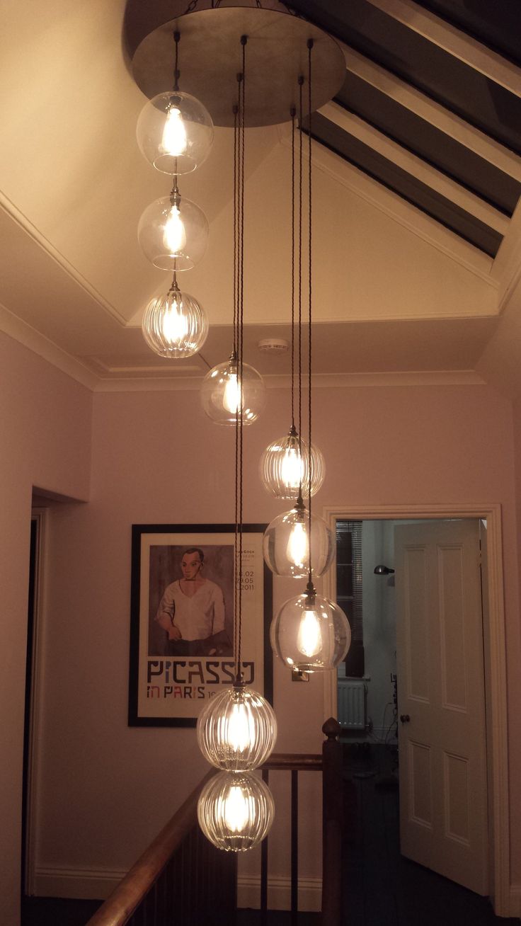 a chandelier hanging from the ceiling in a hallway