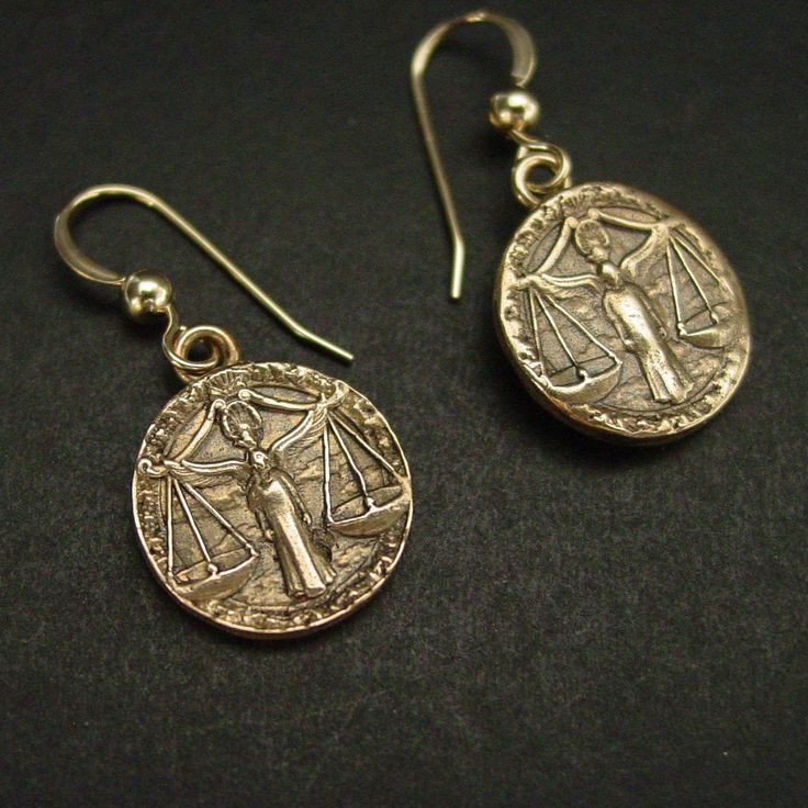 "Handmade antiqued bronze coin charms with the zodiac sign of Libra birthday gift for people born between Sept 23 - Oct 23. Libra are: Cooperative, Diplomatic, Gracious, Fair-minded, Social On those dainty earrings an angel is in the middle overlooking the scale. The concept of the zodiac originated in Babylonian astrology, and was later influenced by Hellenistic culture. According to astrology, celestial phenomena relate to human activity on the principle of \"as above, so below\", so that the Libra Earrings, Libra Jewelry, Zodiac Earrings, Libra Birthday, Cameo Jewelry, Human Activity, Libra Zodiac, September 23, October 23