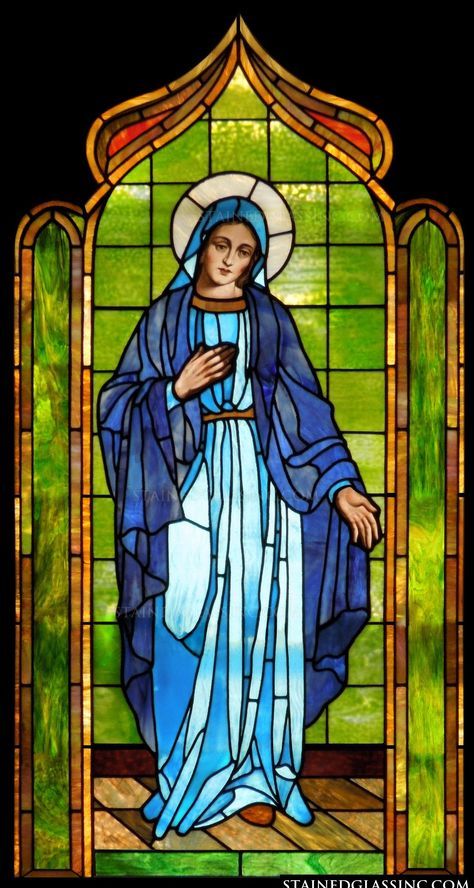 a stained glass window with the image of mary