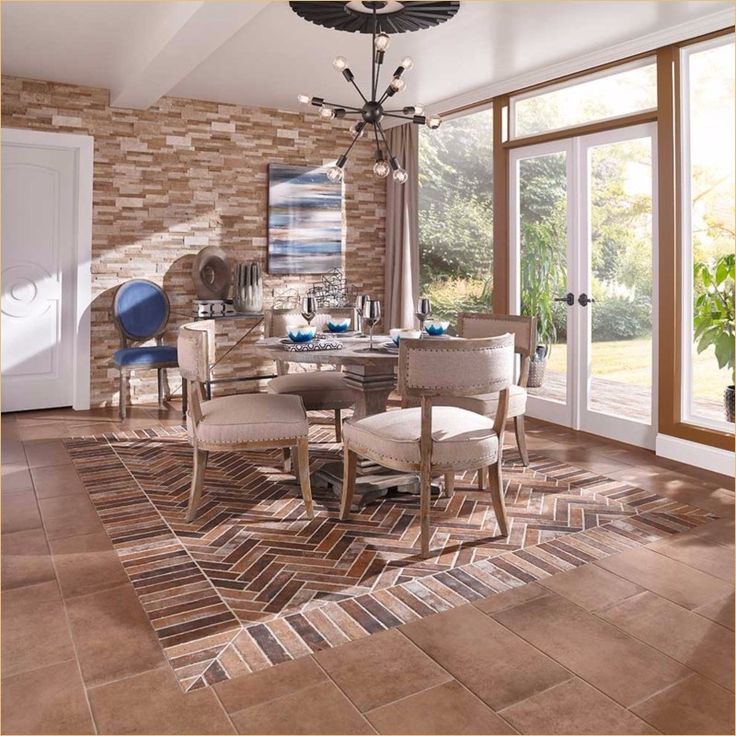 a dining room table and chairs in front of a brick wall