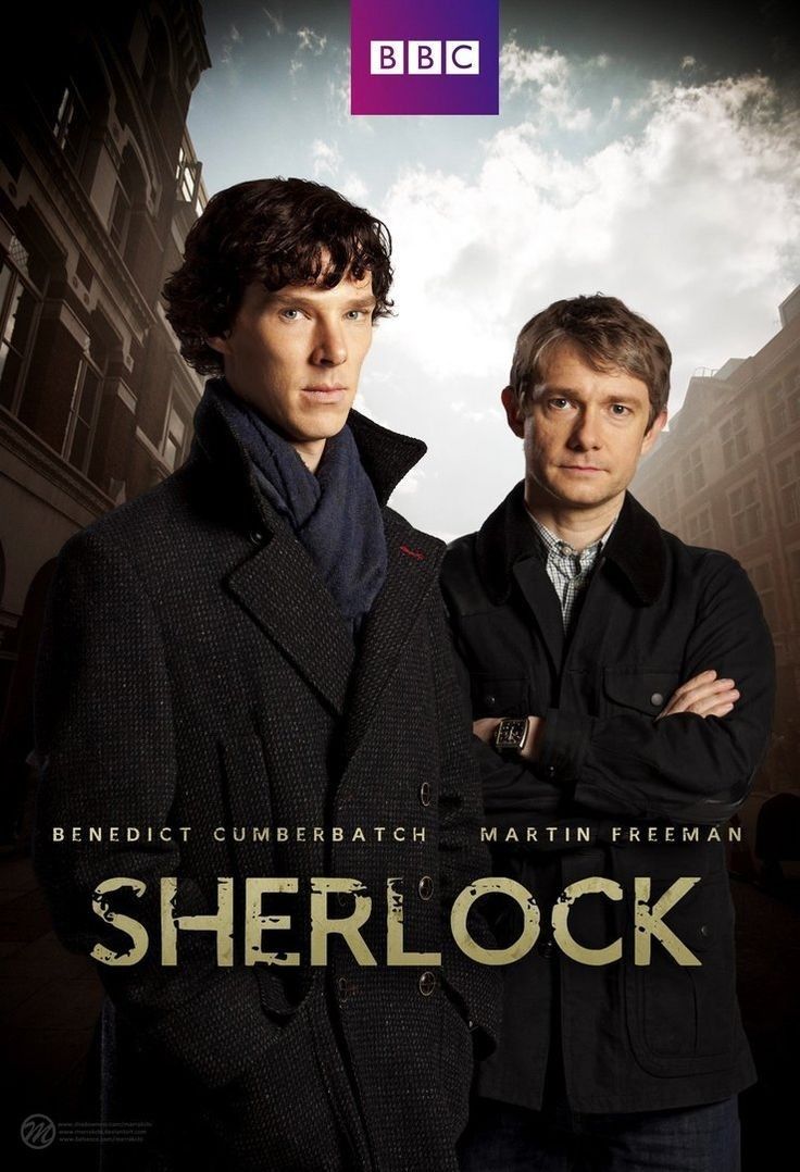 two men standing next to each other in front of a poster for the bbc series, sherlock