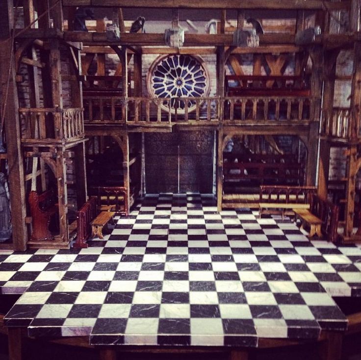 a large checkerboard table in the middle of a room