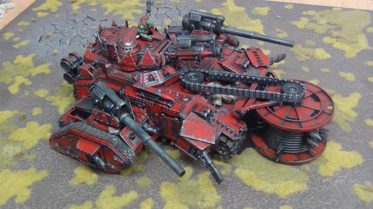 some red and black warhammers laying on the ground