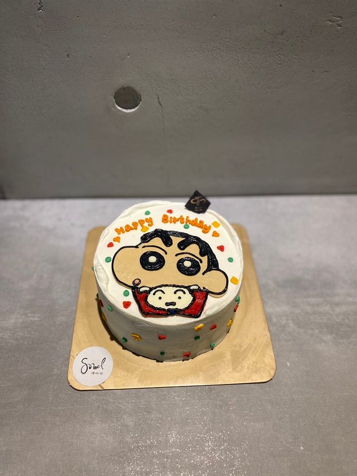 a birthday cake with a monkey face on it