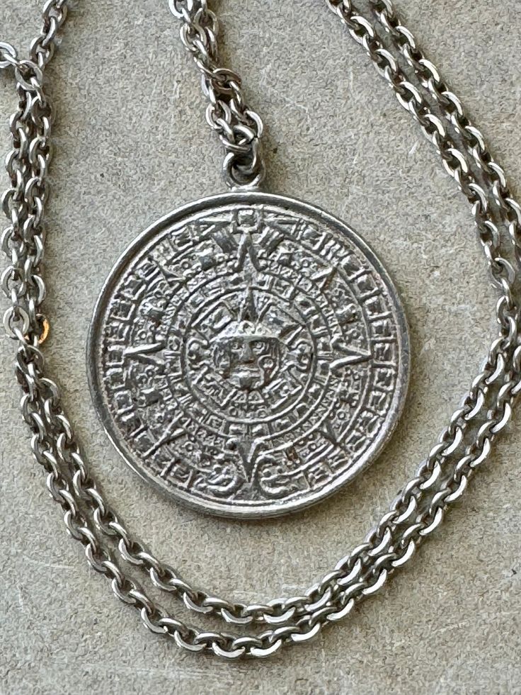 Sterling silver vintage Mexican Myan Calndar  Sun pendant medallion necklace Chain measures about 20 inches around Antique Silver Round Pendant Necklace, Silver Etched Medallion Necklace, Traditional Silver Medallion Pendant Necklace, Antique Sterling Silver Coin Necklace With Round Pendant, Silver Medallion Necklace With Etched Details, Traditional Silver Pendant Medallion Necklace, Vintage Coin Necklace With Large Pendant, Silver Traditional Medallion Pendant Necklace, Antique Silver Etched Pendant Necklace