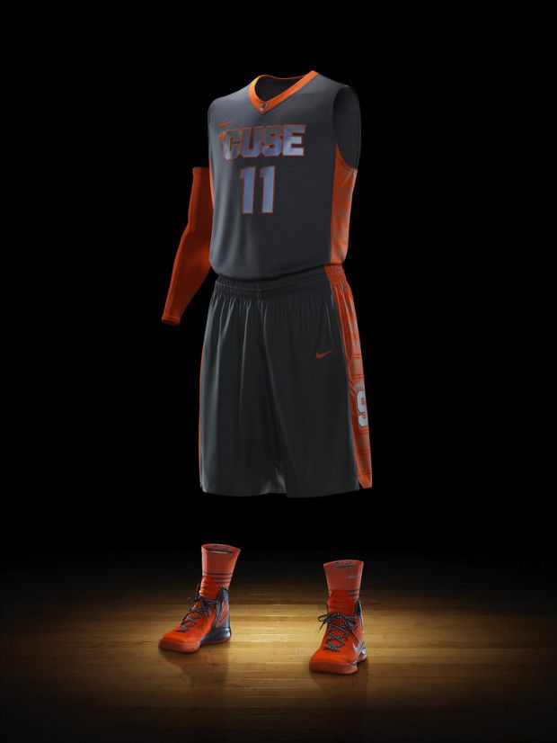 an orange and black basketball uniform is shown on a dark background with the number 11