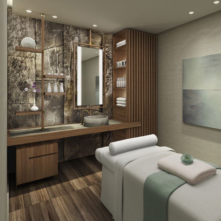 a spa room with stone walls and wood flooring