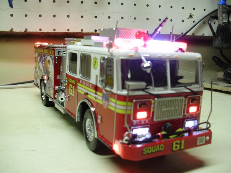 a red fire truck with its lights on