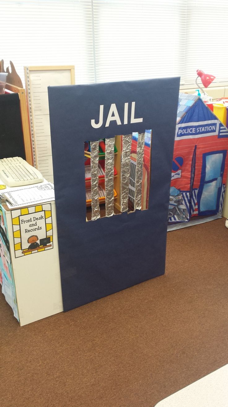 an open book with the word jail on it in front of some bookshelves