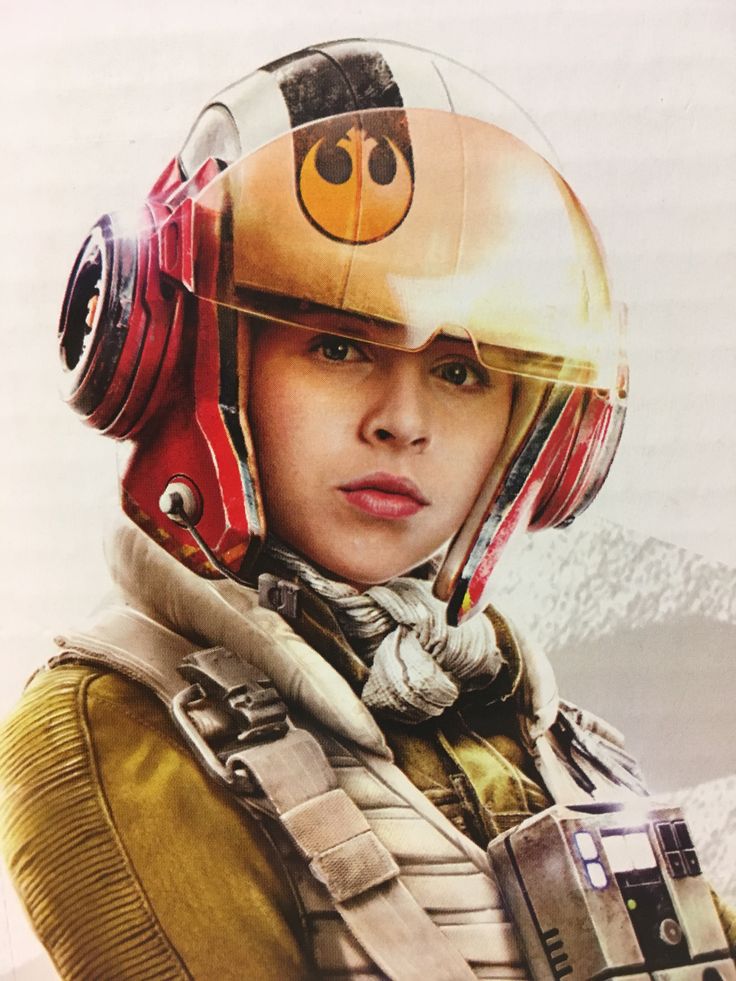 a woman with a helmet and goggles on is looking at the camera while wearing a star wars costume