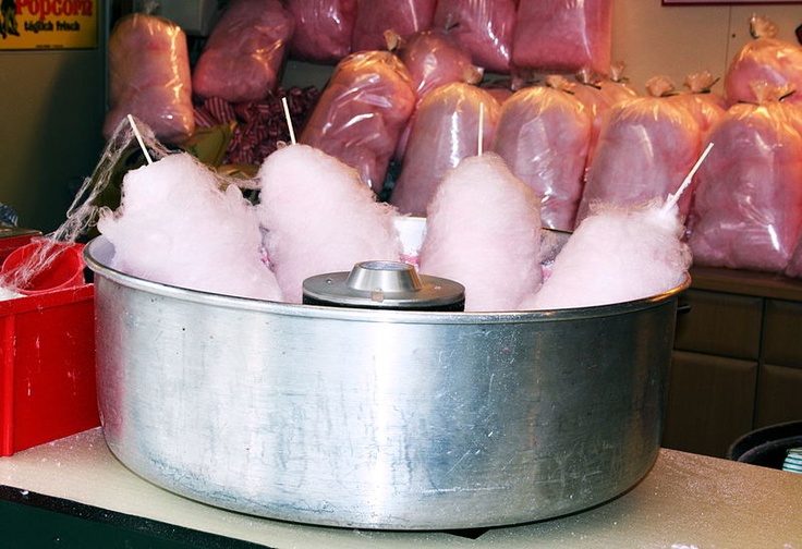 meat wrapped in plastic sitting on top of a metal pan with toothpicks sticking out of it