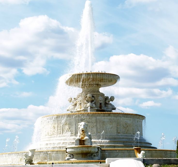 a large fountain with water spouting from it's sides