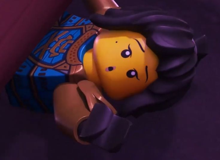 the lego movie character is laying down with his head turned to look like he's crying