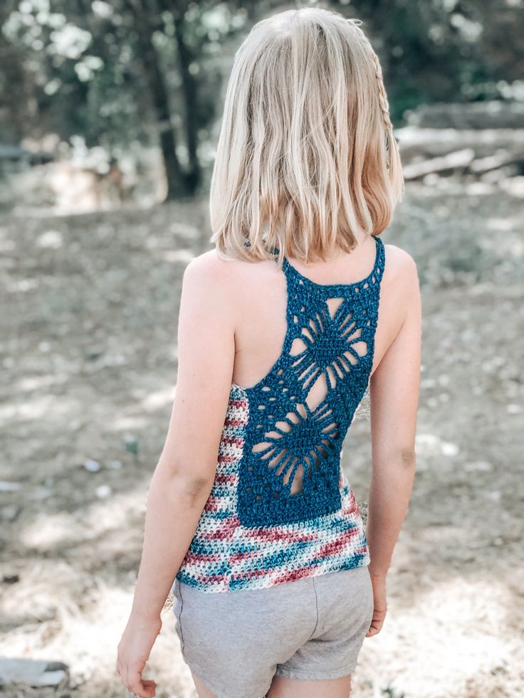 the back of a woman's tank top with crochet