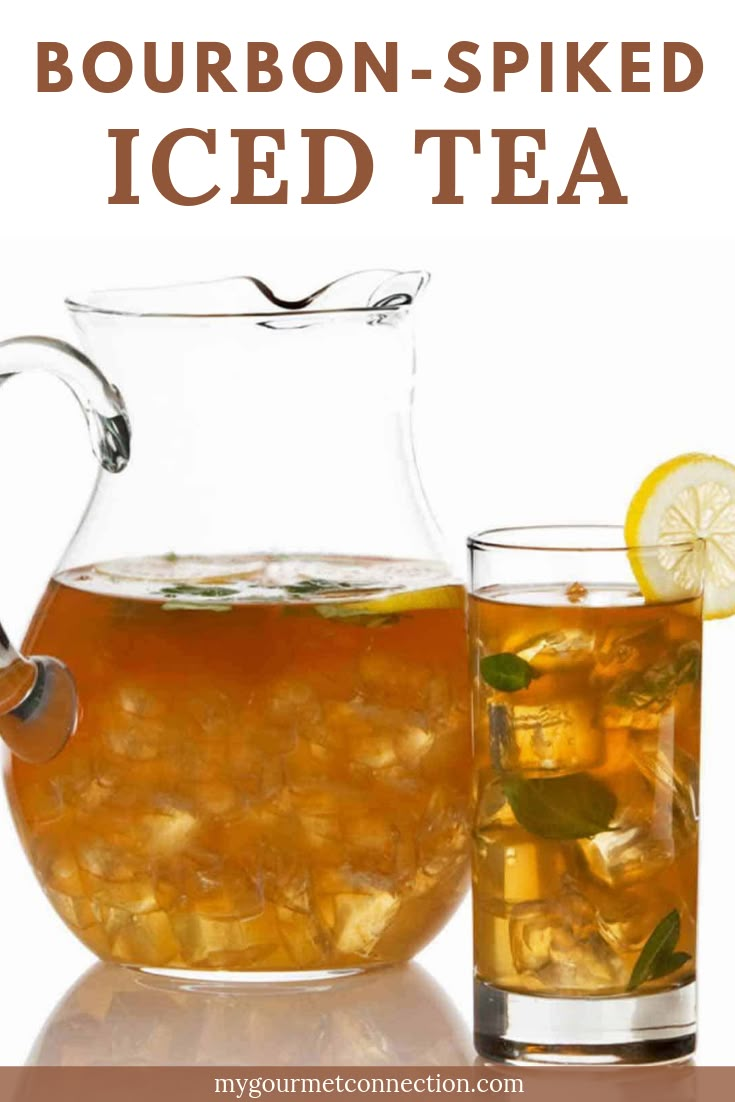 bourbon - spiked iced tea in a pitcher with ice and lemon slices on the side