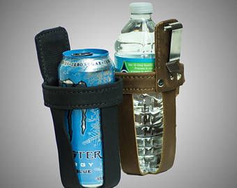 a bottle holder with two cans in it and a cell phone on the other side