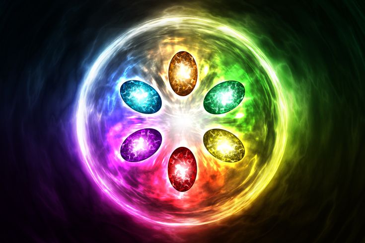 an abstract background with four colorful stones in the center