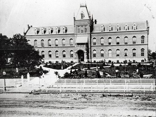 an old black and white photo of a large building