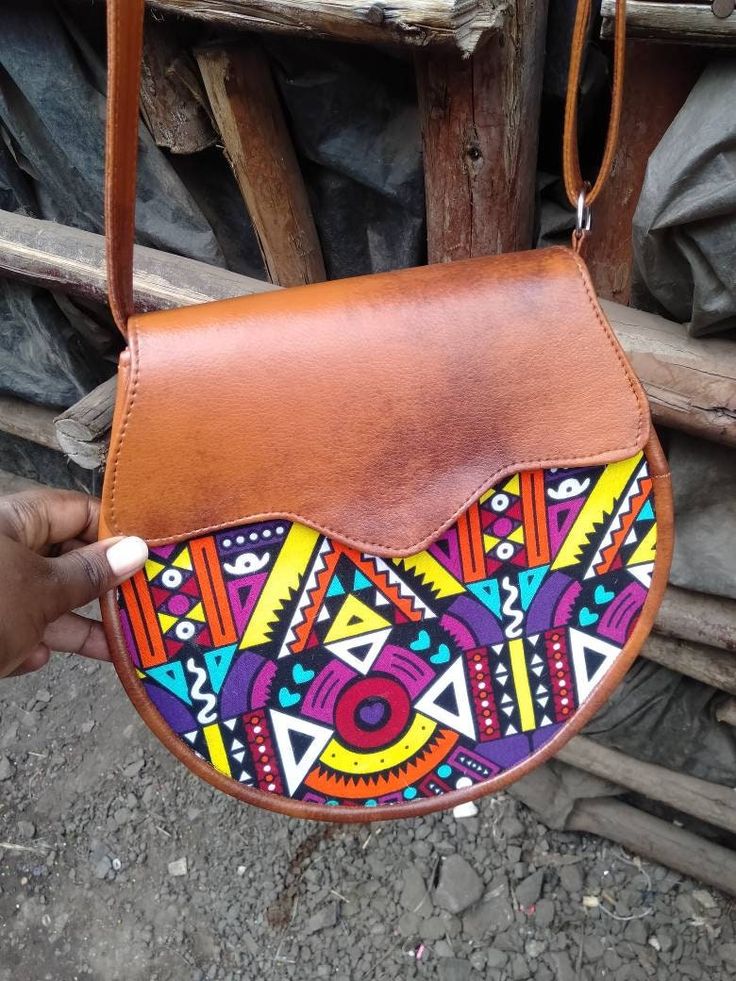 Beautiful bag with Ankara print Best for outing Christmas gift for her Made of leather and Ankara print 100% handmade We ship via DHL express For wholesale please contact me via message Artisan Hand Painted Brown Bags, Red Hand Painted Bags, Bohemian Hand Painted Bags For Daily Use, Hand Painted Brown Shoulder Bag Gift, Brown Hand Painted Satchel Bag, Brown Hand Painted Satchel Shoulder Bag, Hand Painted Brown Rectangular Shoulder Bag, Hand Painted Brown Satchel Shoulder Bag, Multicolor Shoulder Bag With Adjustable Strap As Gift