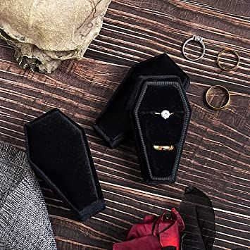 an assortment of rings and jewelry laid out on a table